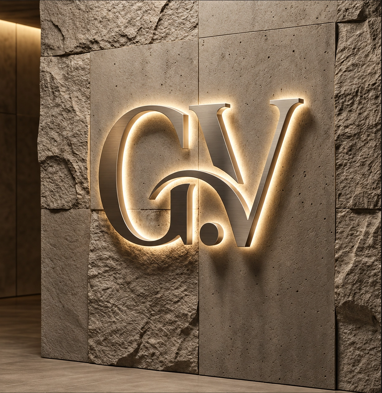 Illuminated G.V wall sign against natural stone and concrete