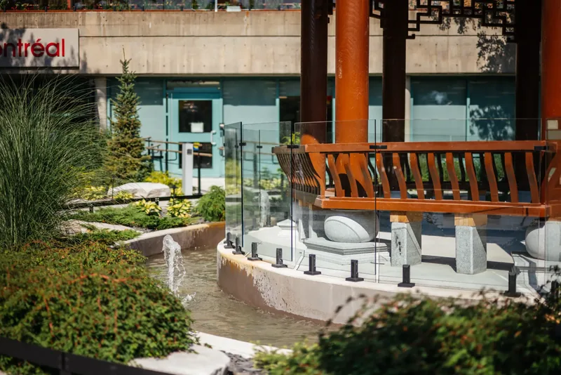 Seating beneath the temple pavilion beside the water