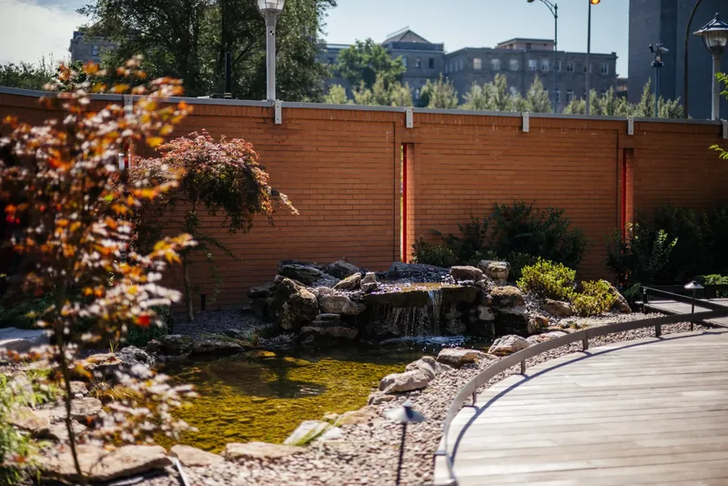 Rockwork waterfall flowing into the garden pond