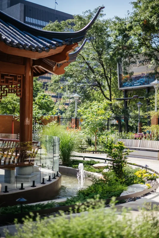 Temple pavilion framed by planting and the garden path