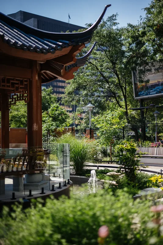Temple pavilion framed by planting and the garden path
