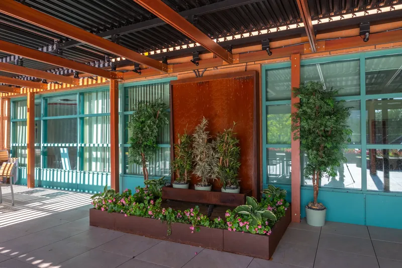 Planters and greenery along the terrace wall