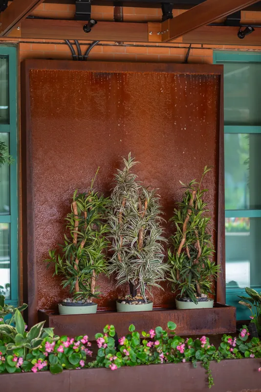 Planters and greenery along the terrace wall