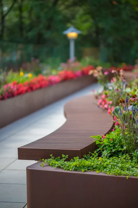 Wood bench integrated into a terrace planter