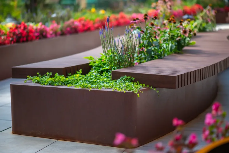 Wood bench integrated into a terrace planter