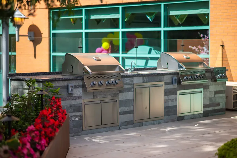 Outdoor kitchen with built-in grills on the terrace