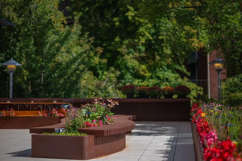 Wood bench integrated into a terrace planter