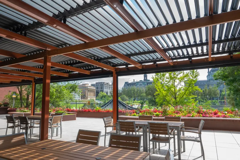 Dining tables beneath the terrace pergola