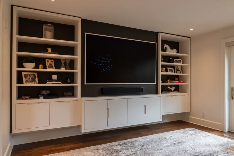 Family room media wall with built-in shelving and cabinetry