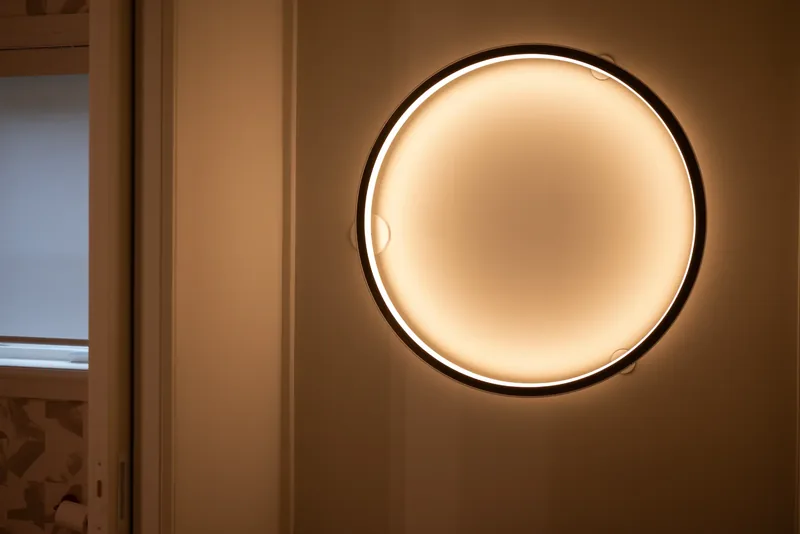 Close-up of the round backlit wall light