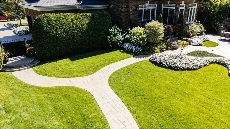 Aerial view of curving walkways across the lawn and garden beds