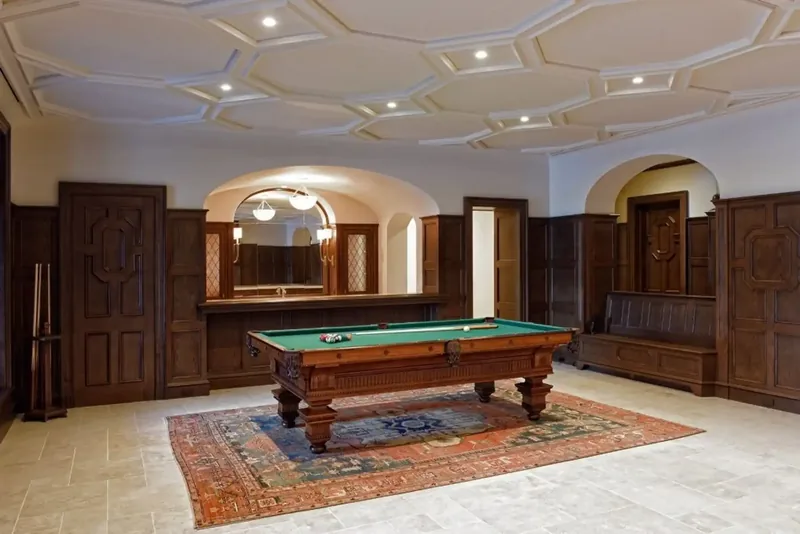Games room with a billiard table, a coffered ceiling, and wood panelling