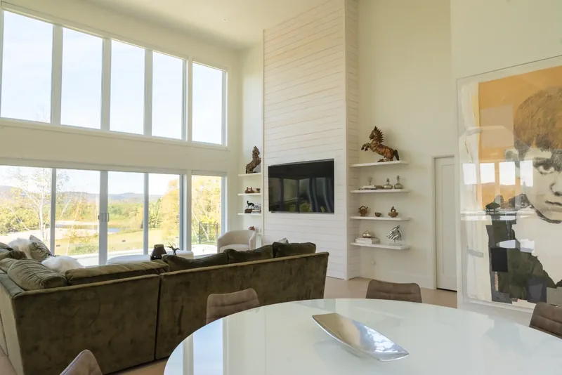 Dining area and great room with the white shiplap media wall